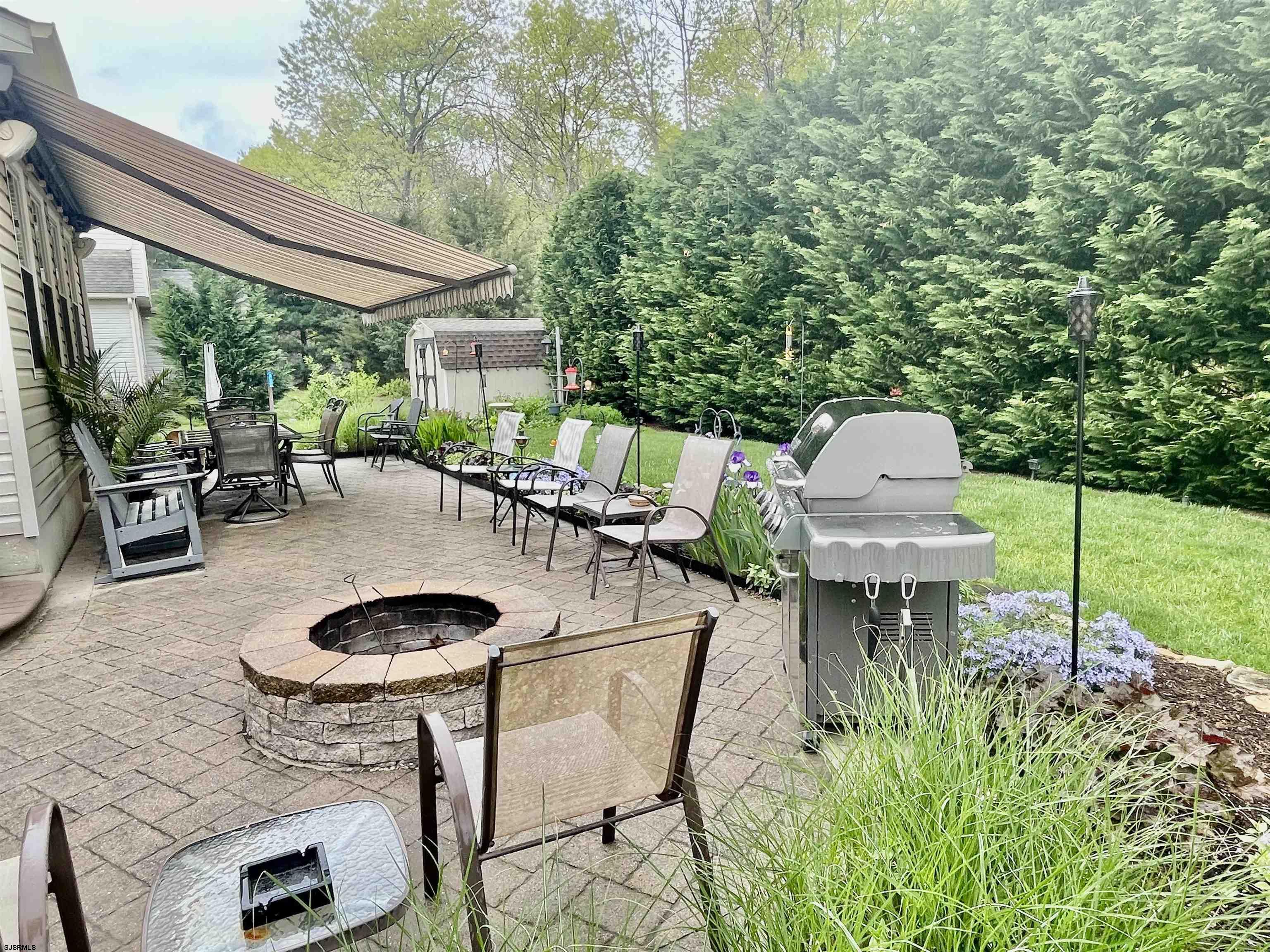 30 Cottage Road Egg Harbor Township, NJ 08234 - Photo 19 of 22 a backyard of a house with outdoor seating