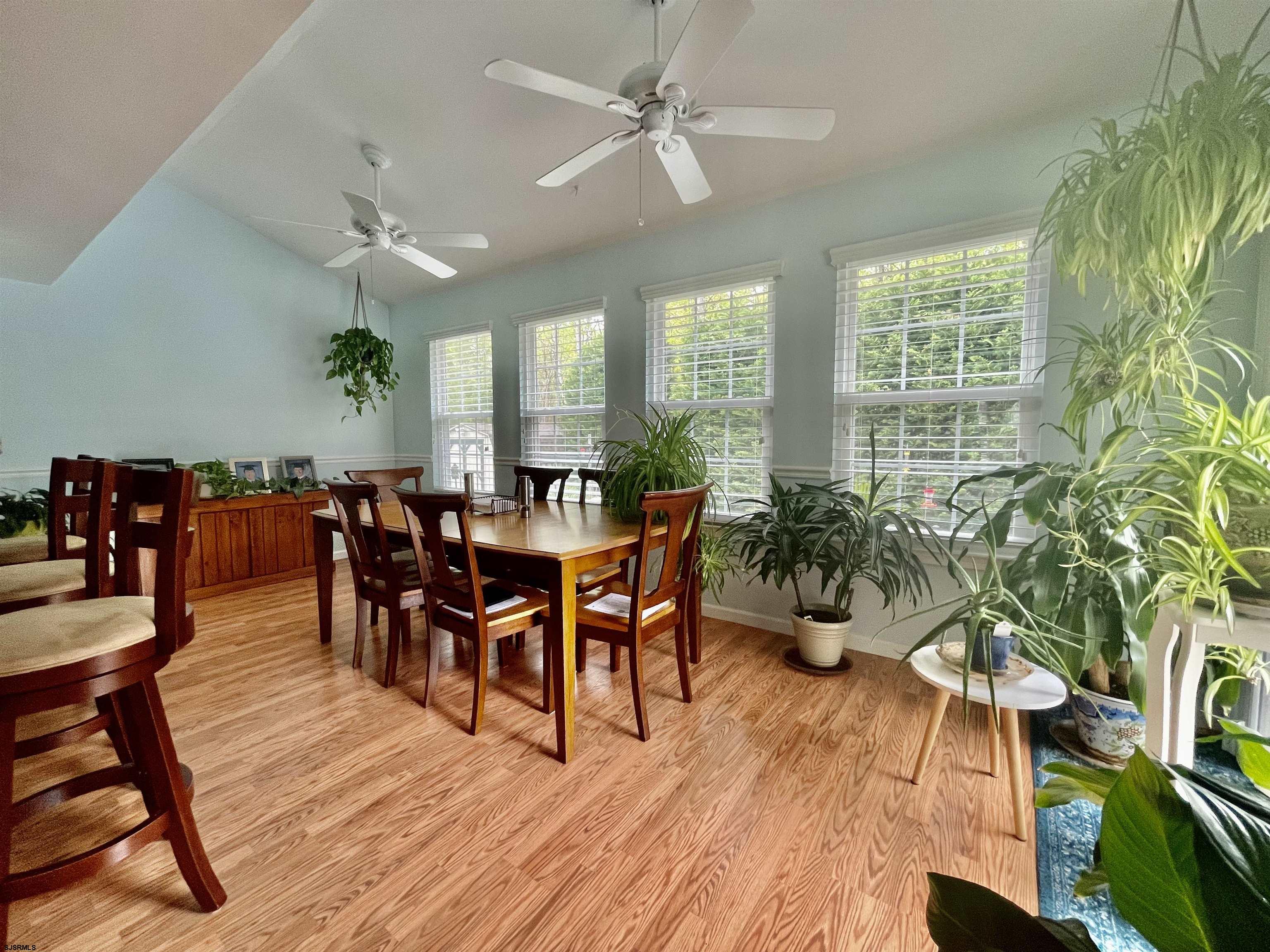 30 Cottage Road Egg Harbor Township, NJ 08234 - Photo 5 of 22 a view of a dining room and livingroom with furniture wooden floor a chandelier