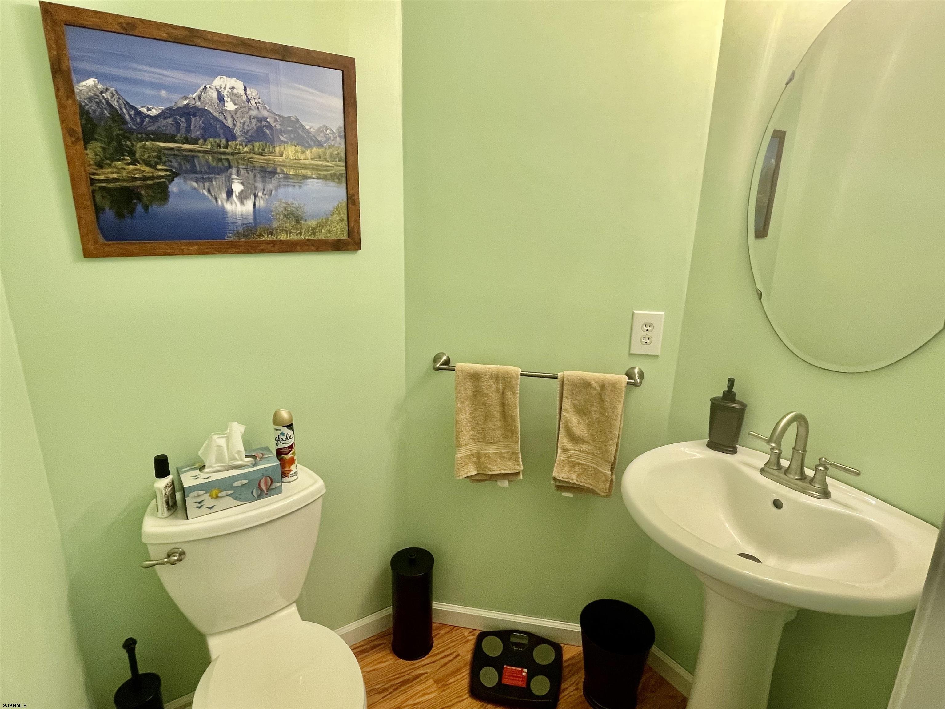 30 Cottage Road Egg Harbor Township, NJ 08234 - Photo 9 of 22 a bathroom with a toilet sink and mirror