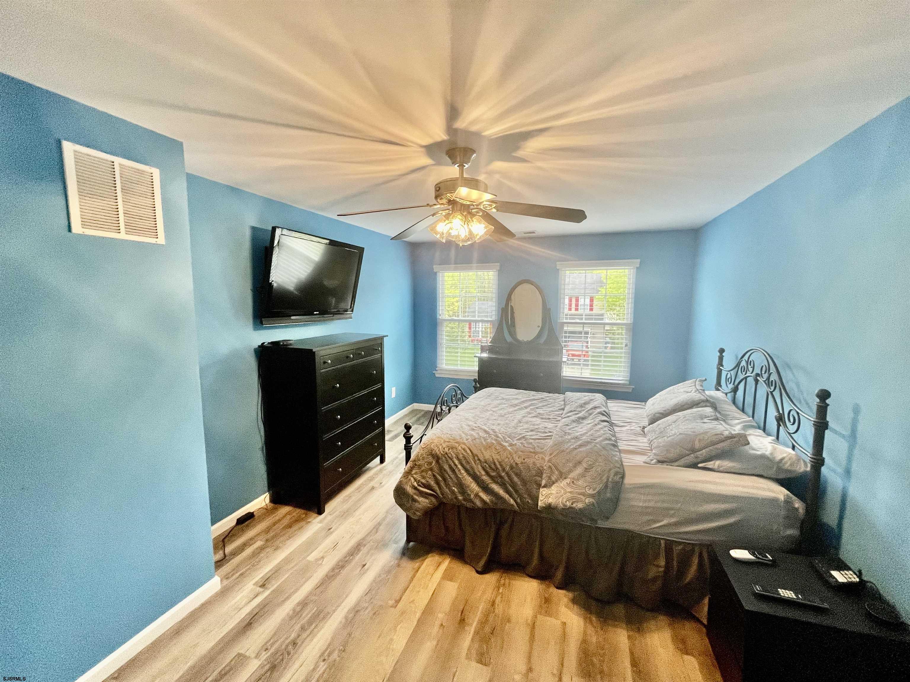 30 Cottage Road Egg Harbor Township, NJ 08234 - Photo 10 of 22 a bedroom with a bed and a flat screen tv