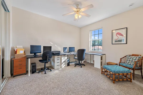 an aerial view of a house with a garden and lake view