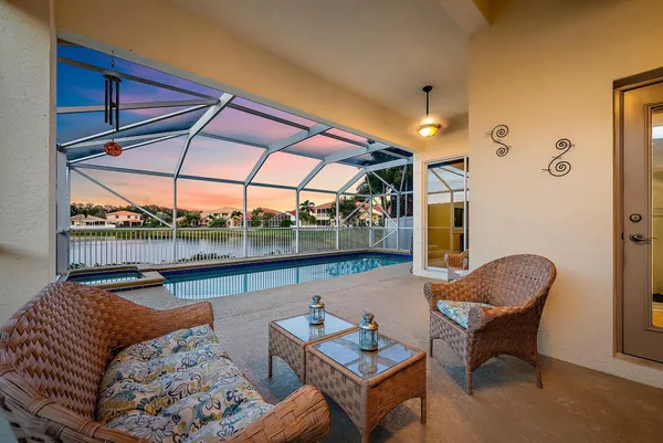 an aerial view of a house with a swimming pool yard and outdoor seating