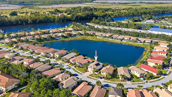 an aerial view of a house with a swimming pool