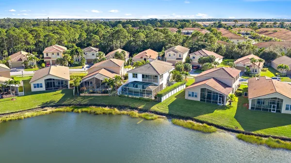 an aerial view of residential houses with outdoor space