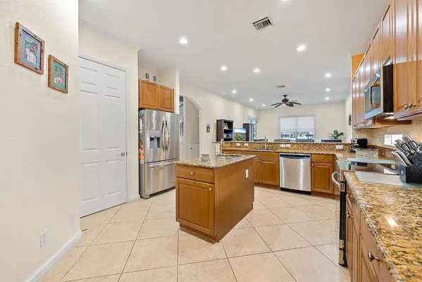 a view of a dining room with furniture and a window