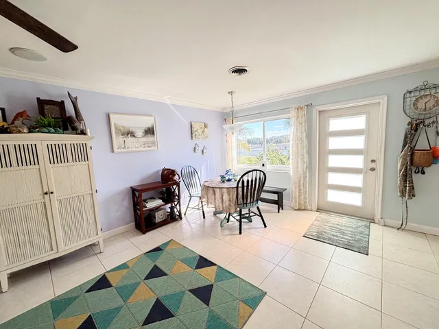 a living room with furniture and a rug