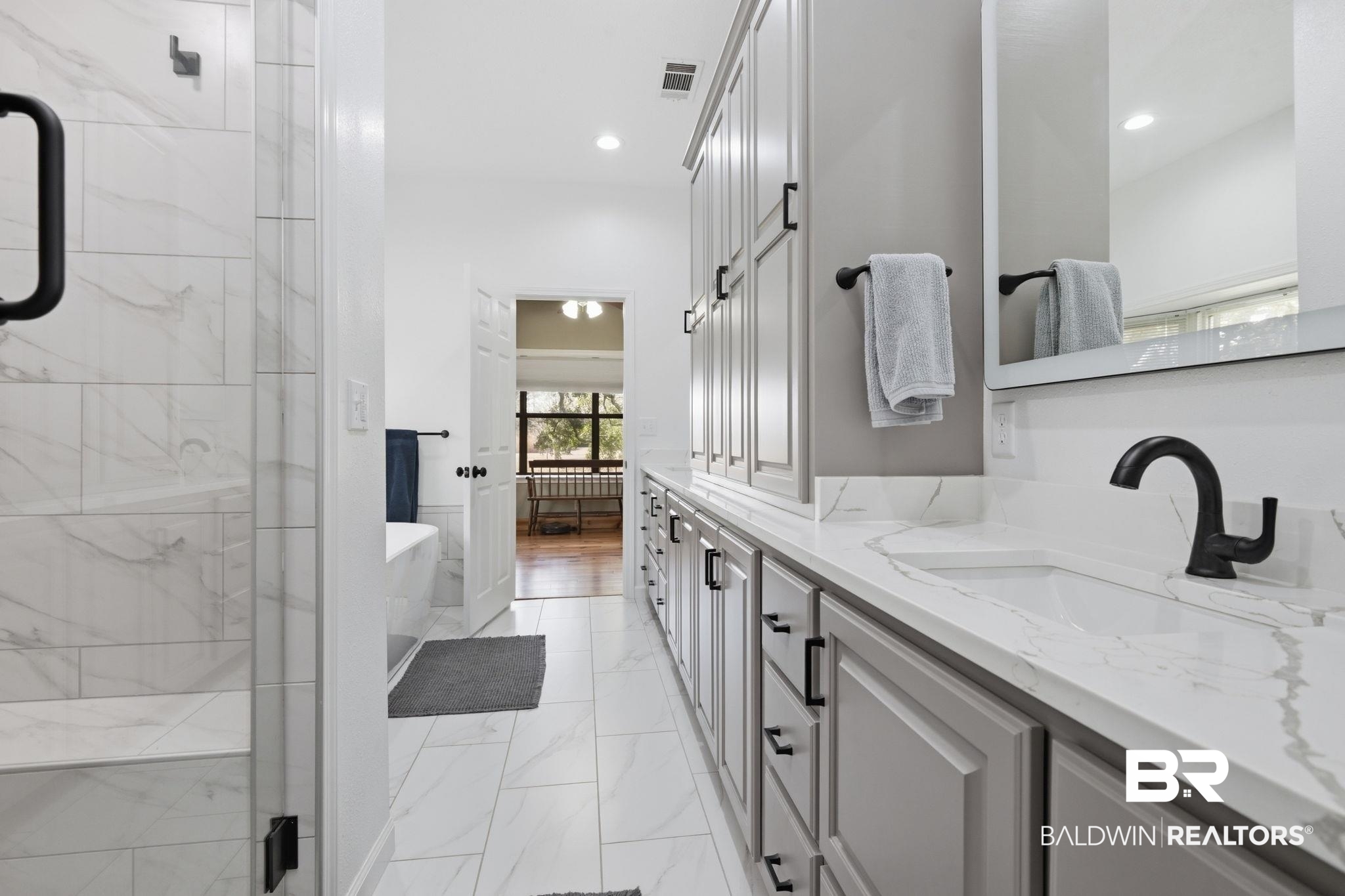 15025 Bellingrath Road Coden, AL 36523 - Photo 58 of 79 Bathroom featuring a freestanding tub, double vanity, light marble finish floors, a marble finish shower, and recessed lighting