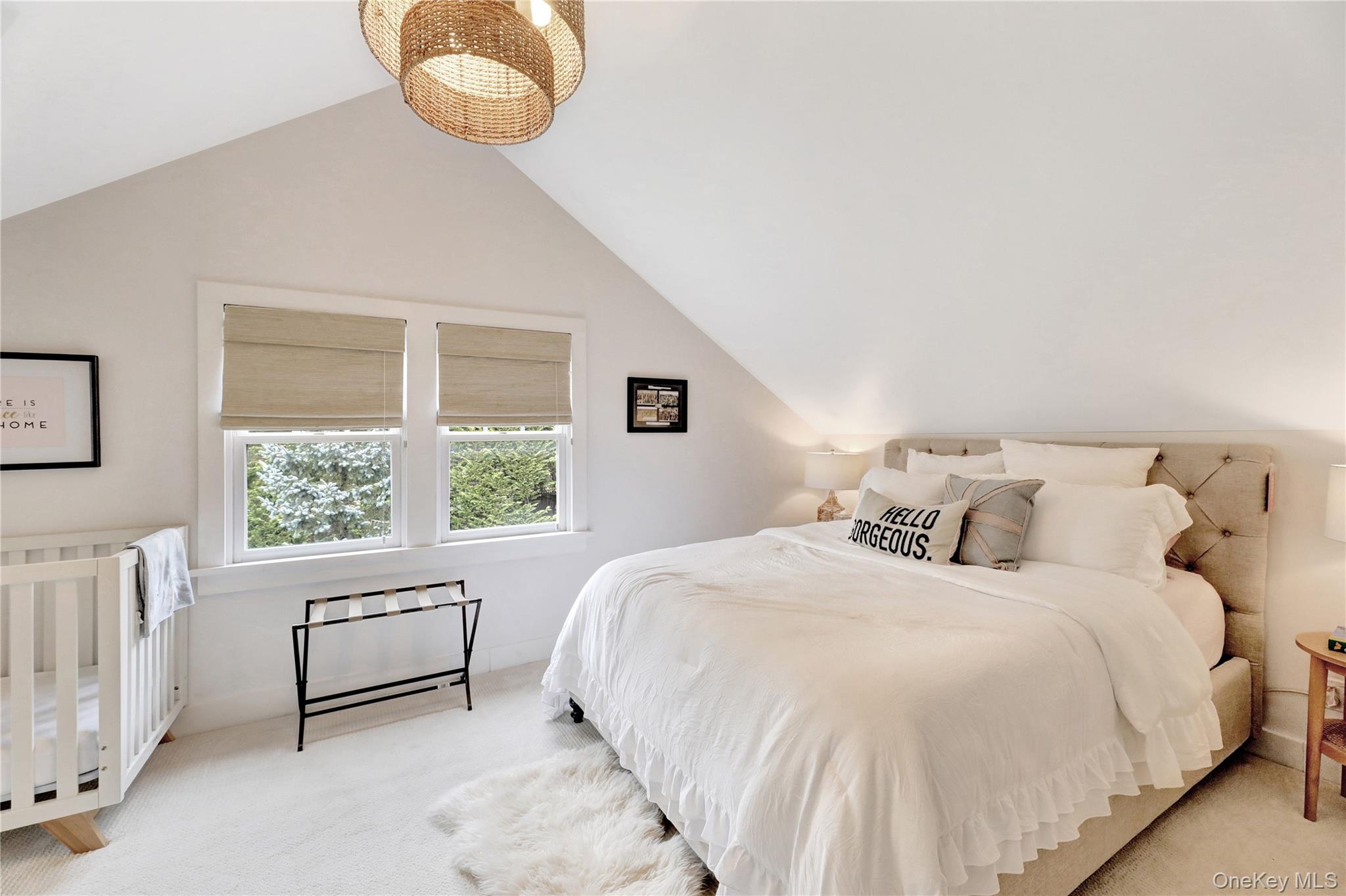 198 South Country Road Remsenburg, NY 11960 - Photo 27 of 49 a spacious bedroom with a bed and window