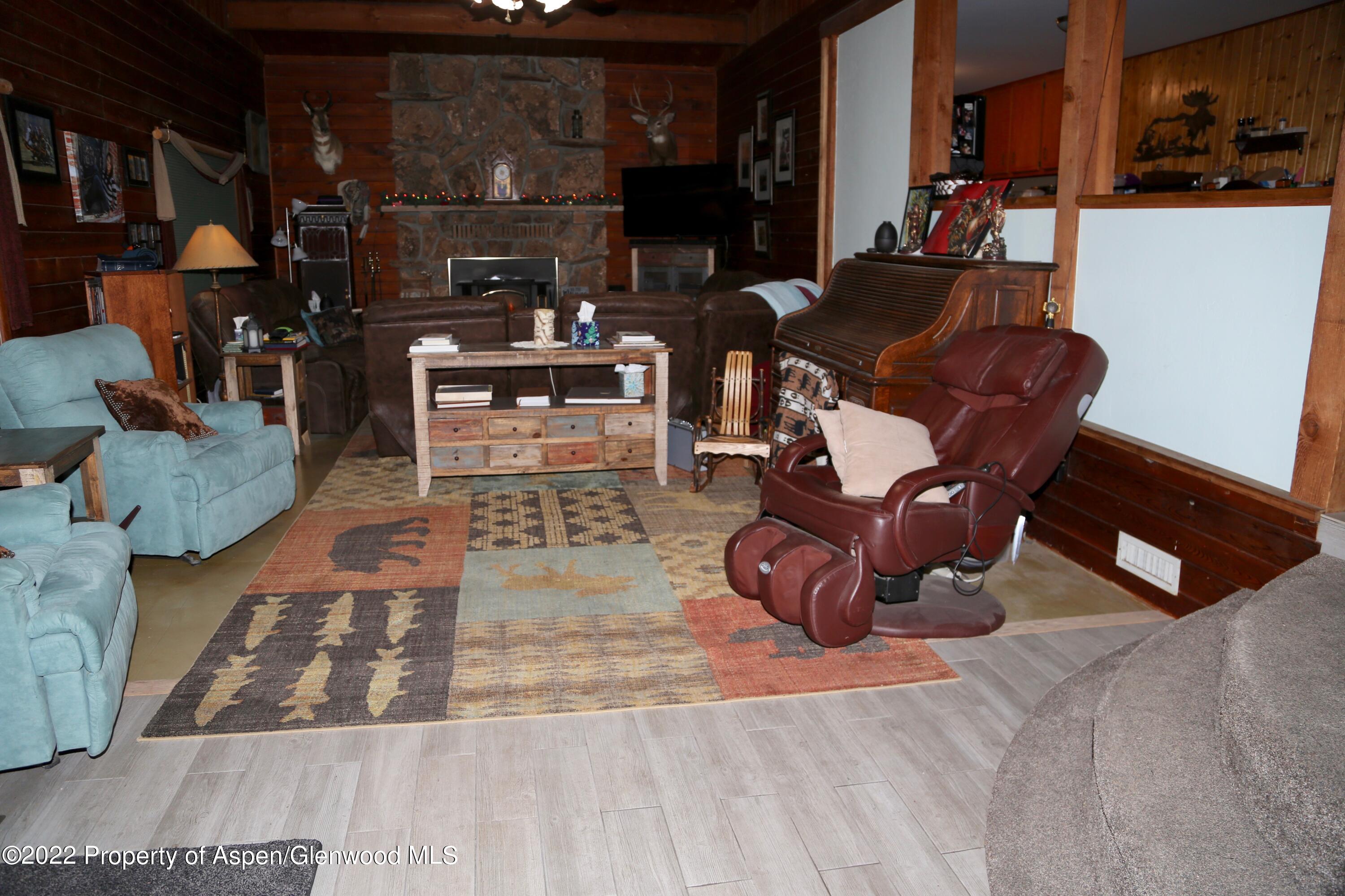756 County Road 221 Rifle, CO 81650 - Photo 15 of 15 a living room with furniture and a rug
