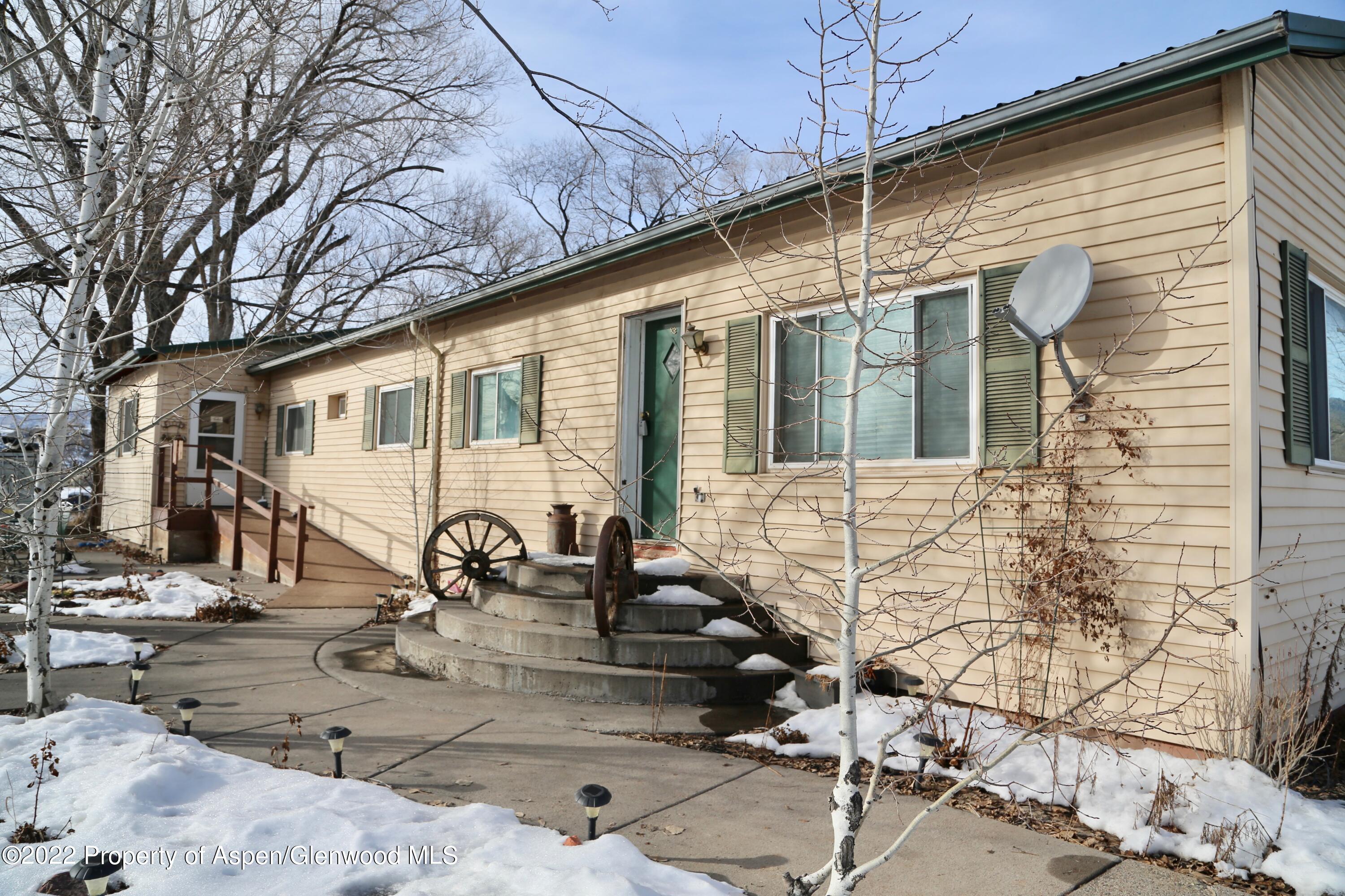756 County Road 221 Rifle, CO 81650 - Photo 2 of 15 a front view of a house with patio