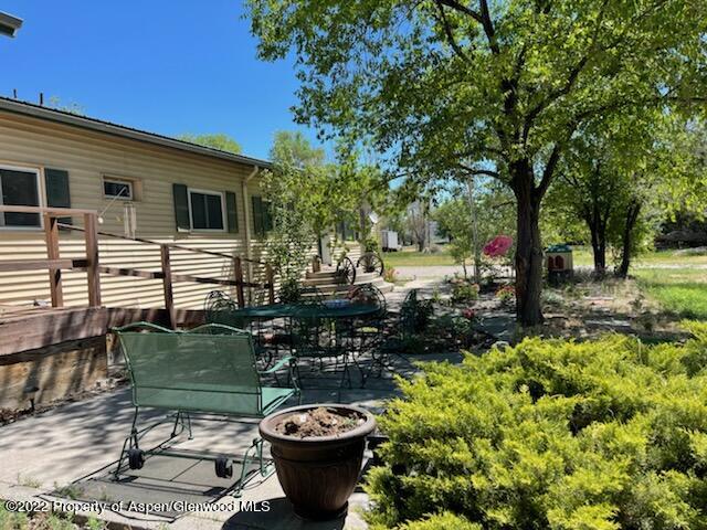 756 County Road 221 Rifle, CO 81650 - Photo 4 of 15 a view of a backyard with plants and a patio