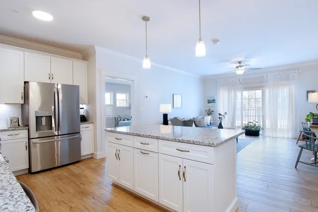 a kitchen with counter top space and stainless steel appliances