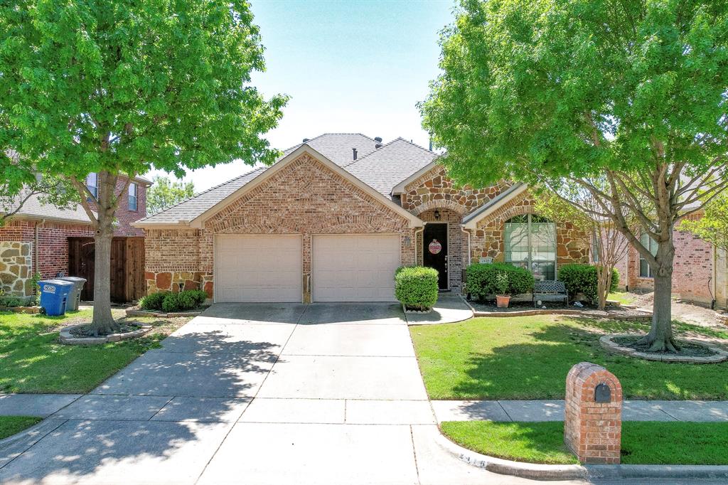 2416 Yuma Drive Little Elm, TX 75068 - Photo 1 of 22 a front view of a house with a yard and garage