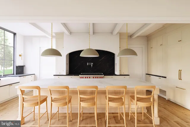 a kitchen with a table and chairs