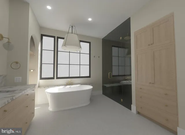 a spacious bathroom with a tub sink shower and mirror