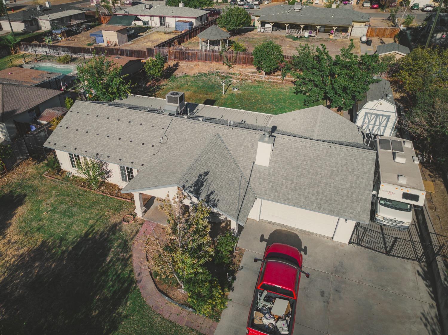 17313 Road 26 Madera, CA 93638 - Photo 9 of 15 an aerial view of a house with a yard and pool