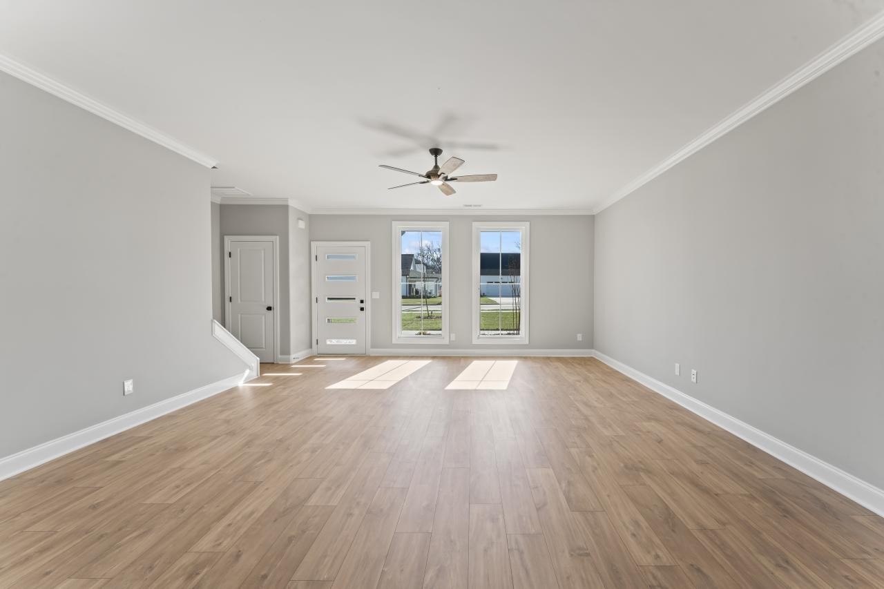 2124 Gracie Bug Loop Murfreesboro, TN 37128 - Photo 12 of 25 wooden floor in an empty room with a window
