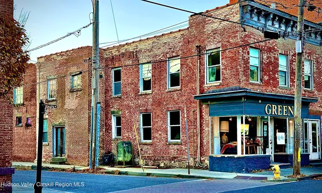 a view of a building with a yard