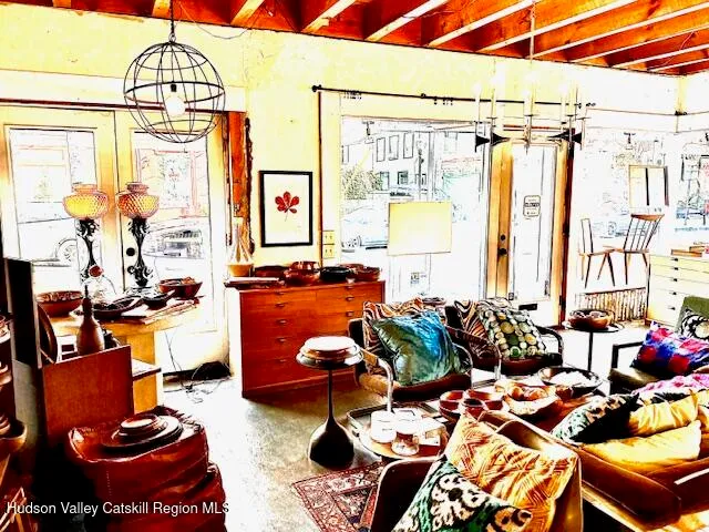 a view of a patio with dining table and chairs
