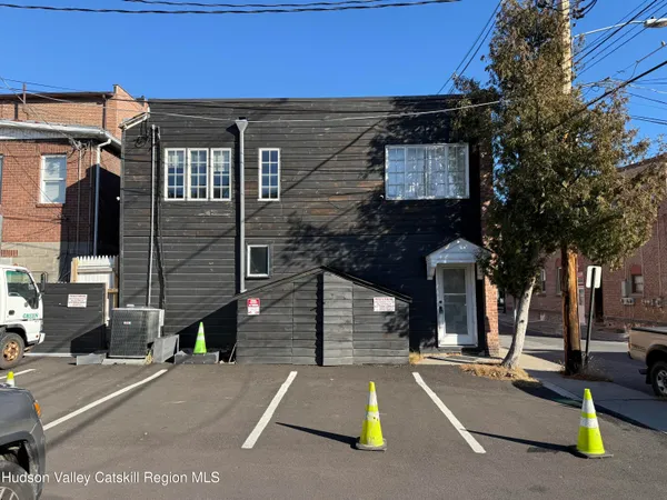 a view of a brick building with many windows