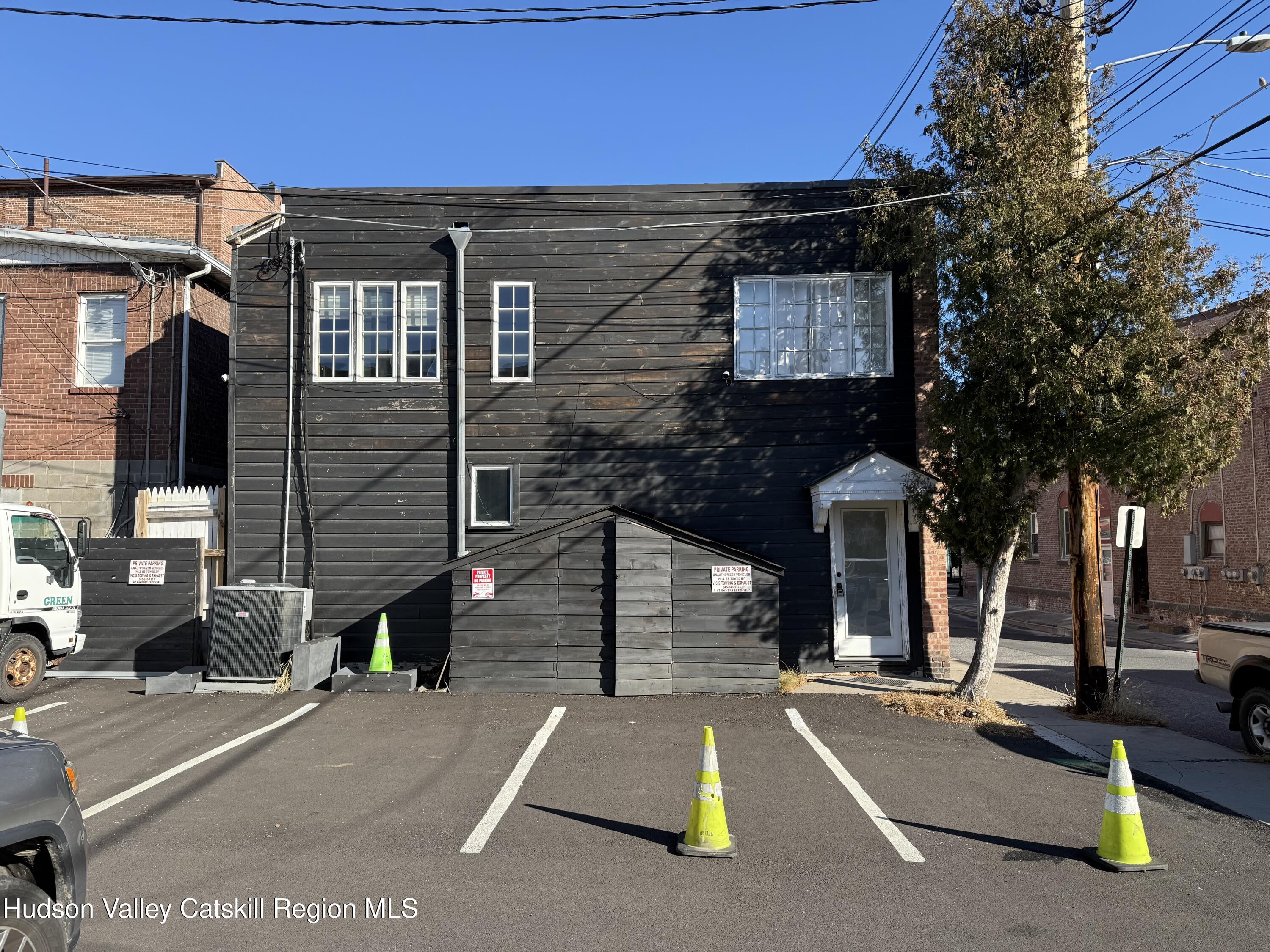 92 Partition Street Saugerties, NY 12477 - Photo 6 of 25 a view of a brick building with many windows