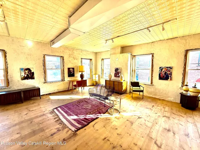 a living room with furniture and a table