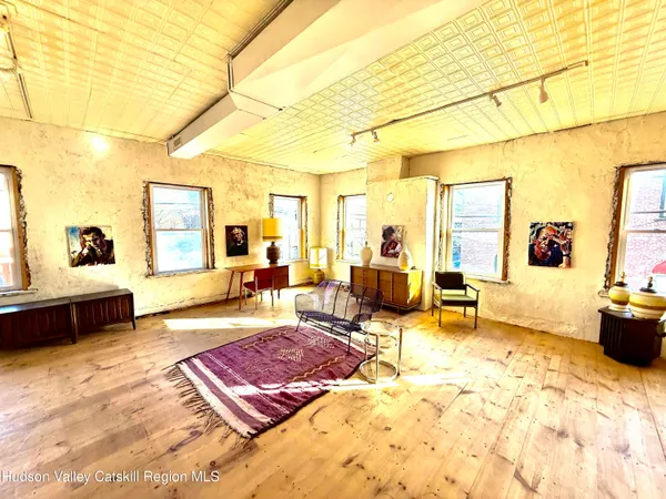 a living room with furniture and a table