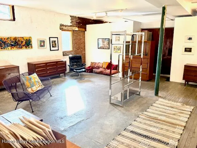 a view of a livingroom with furniture and a couch