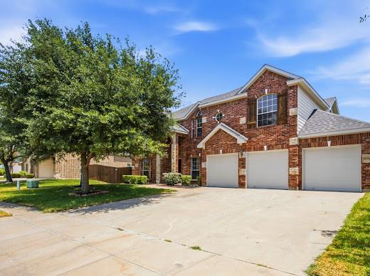 5034 West Fall Drive Midlothian, TX 76065 - Photo 2 of 40 Brick exterior with stone accents and a three-car garage