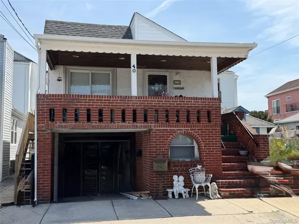 a front view of a house with parking