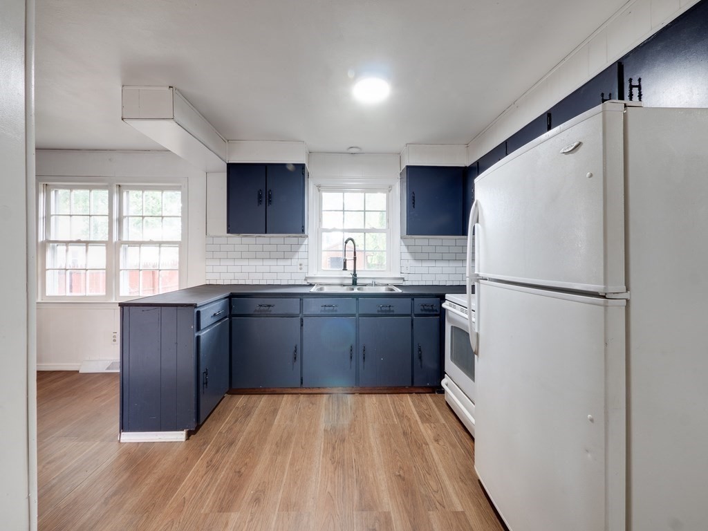 25 French Street Springfield, MA 01104 - Photo 6 of 16 a kitchen with granite countertop a refrigerator and a sink