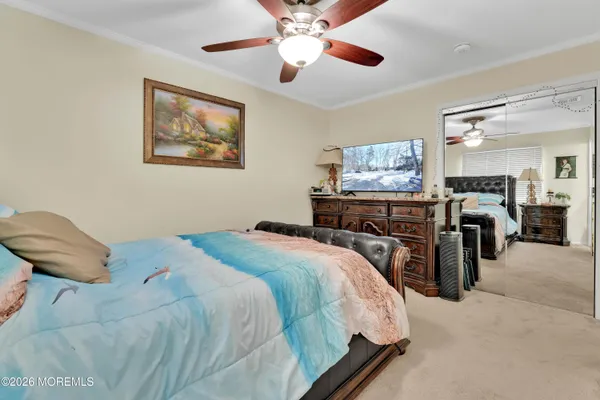 a bedroom with bed and furniture