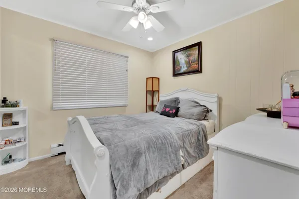 a bedroom with bed and a window