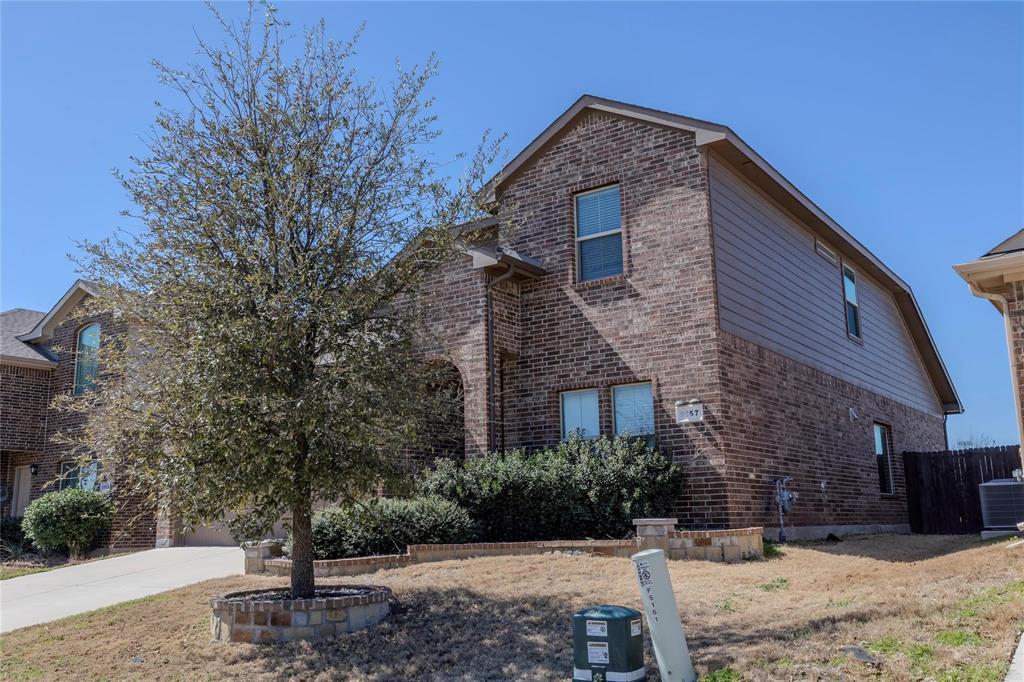 5157 Grayson Ridge Drive Fort Worth, TX 76179 - Photo 2 of 34 a front view of a house with a yard