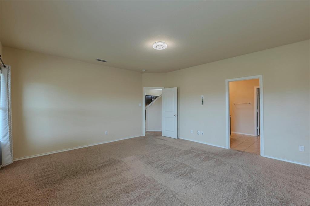 5157 Grayson Ridge Drive Fort Worth, TX 76179 - Photo 24 of 34 an empty room with an entryway and empty room