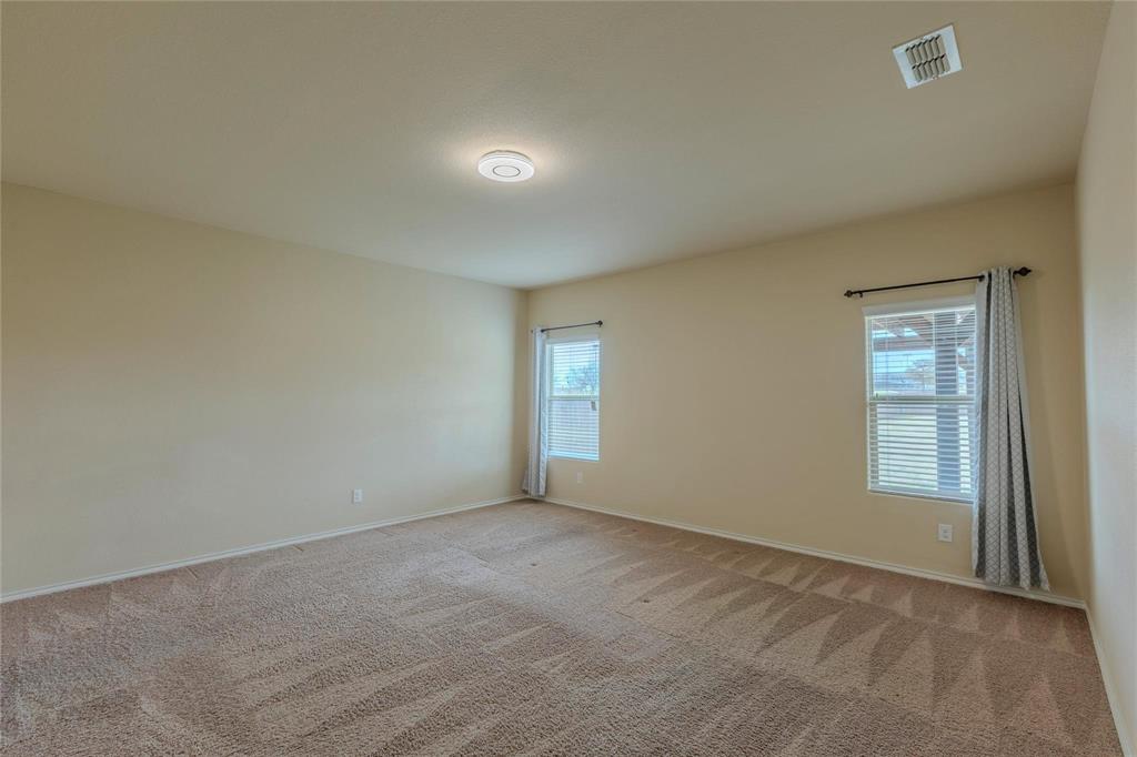 5157 Grayson Ridge Drive Fort Worth, TX 76179 - Photo 25 of 34 an empty room with windows