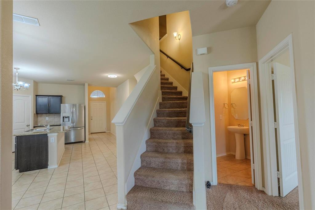 5157 Grayson Ridge Drive Fort Worth, TX 76179 - Photo 27 of 34 a view of a hallway view with staircase and bathroom view