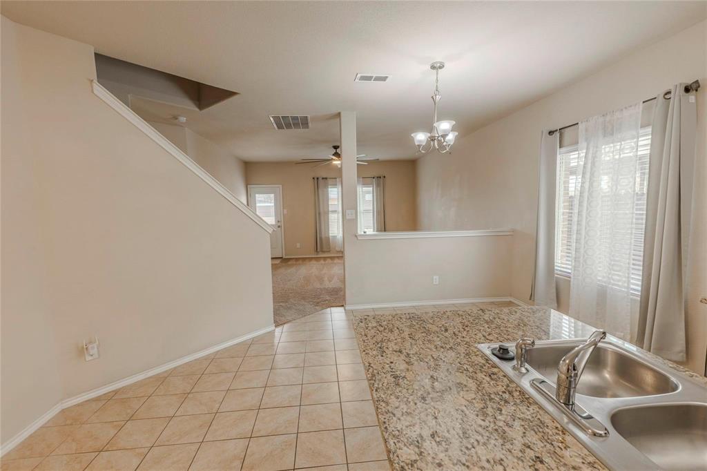 5157 Grayson Ridge Drive Fort Worth, TX 76179 - Photo 33 of 34 a view of a livingroom with a kitchen