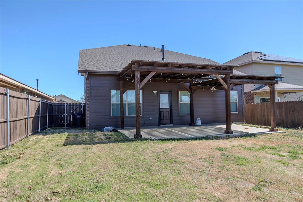 5157 Grayson Ridge Drive Fort Worth, TX 76179 - Photo 6 of 34 a front view of a house with a yard