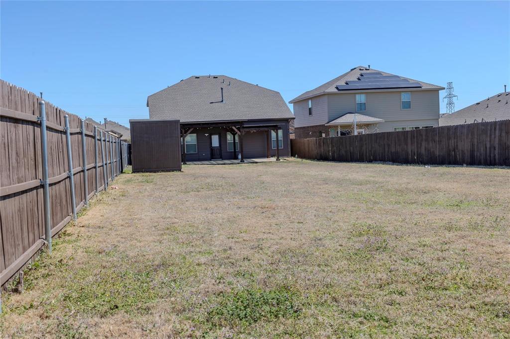 5157 Grayson Ridge Drive Fort Worth, TX 76179 - Photo 8 of 34 a front view of a house with a yard