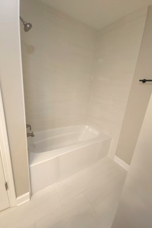 501 Leah Lane, Unit 2A Woodstock, IL 60098 - Photo 12 of 13 a view of a bathtub in bathroom