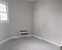 501 Leah Lane, Unit 2A Woodstock, IL 60098 - Photo 9 of 13 an empty room with a window