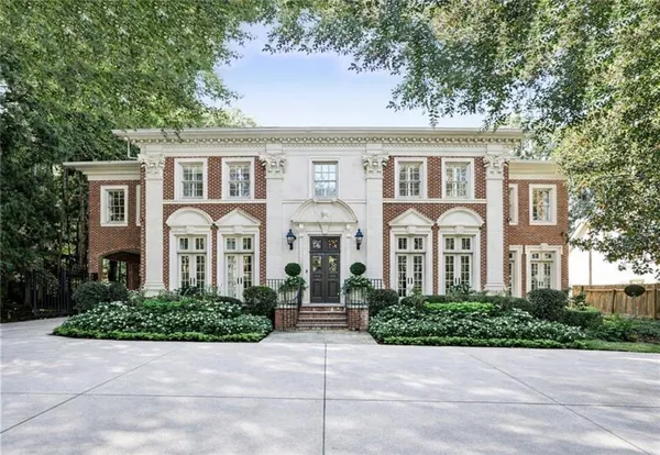 a front view of a house with yard