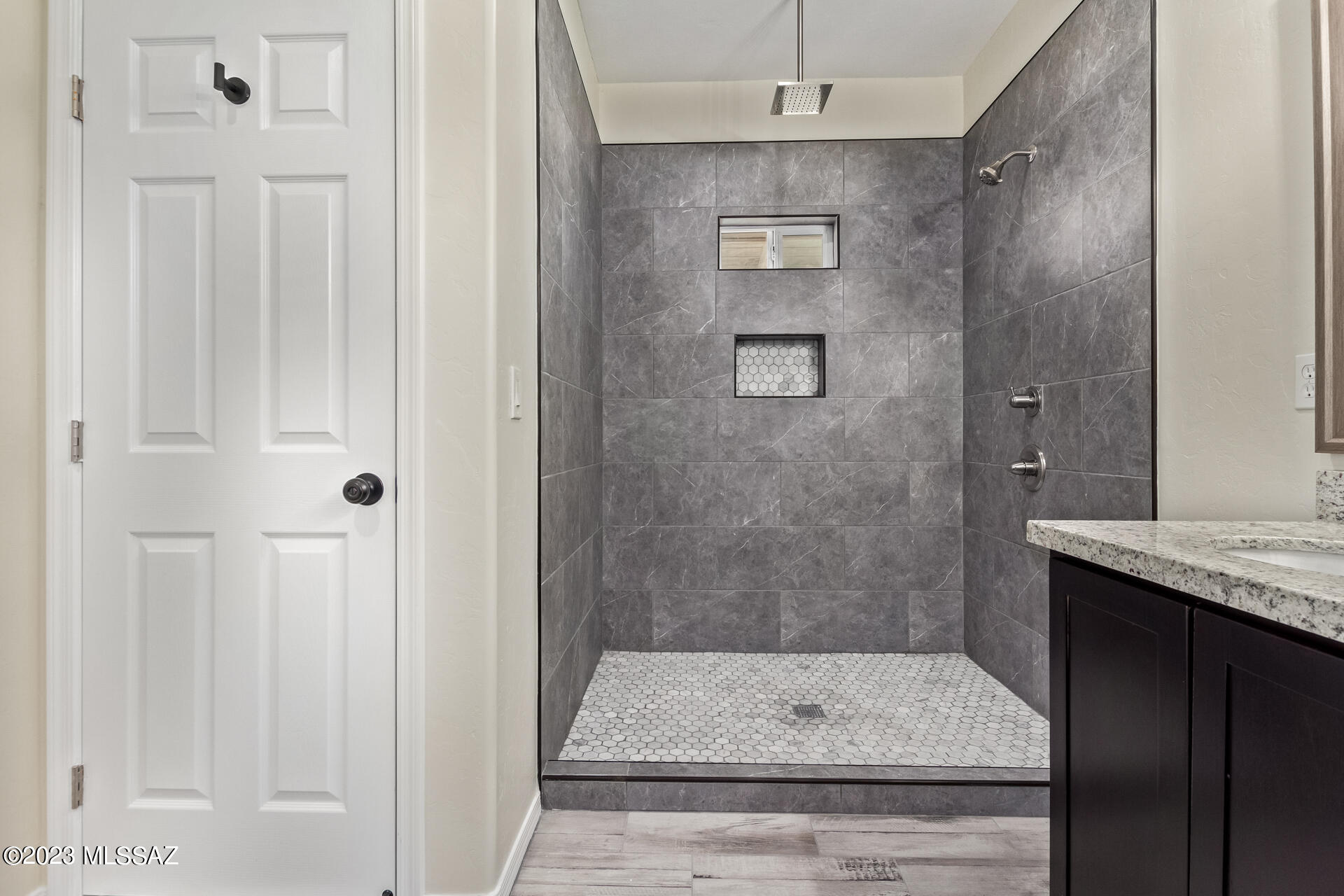 1795 Escobedo Court Rio Rico, AZ 85648 - Photo 19 of 30 a bathroom with a granite countertop shower