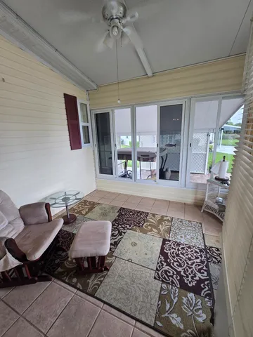 a living room with furniture and flat screen tv