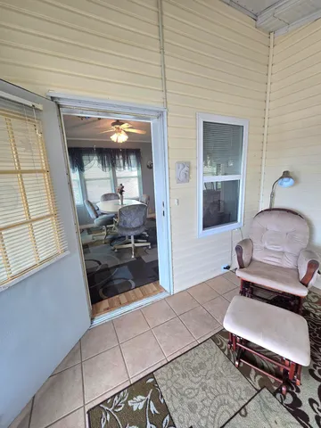 a kitchen with granite countertop a refrigerator sink and cabinets