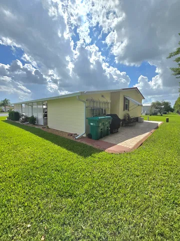 a aerial view of a house with swimming pool and garden