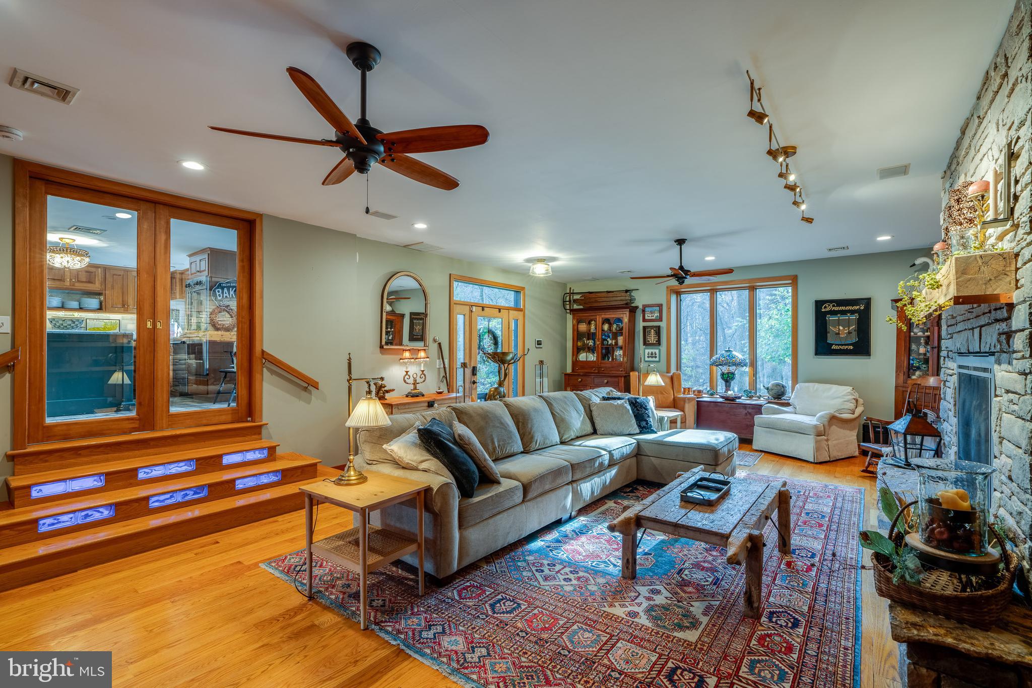 181 Old Mine Road Lebanon, PA 17042 - Photo 14 of 79 a living room with furniture gym equipment and a large window