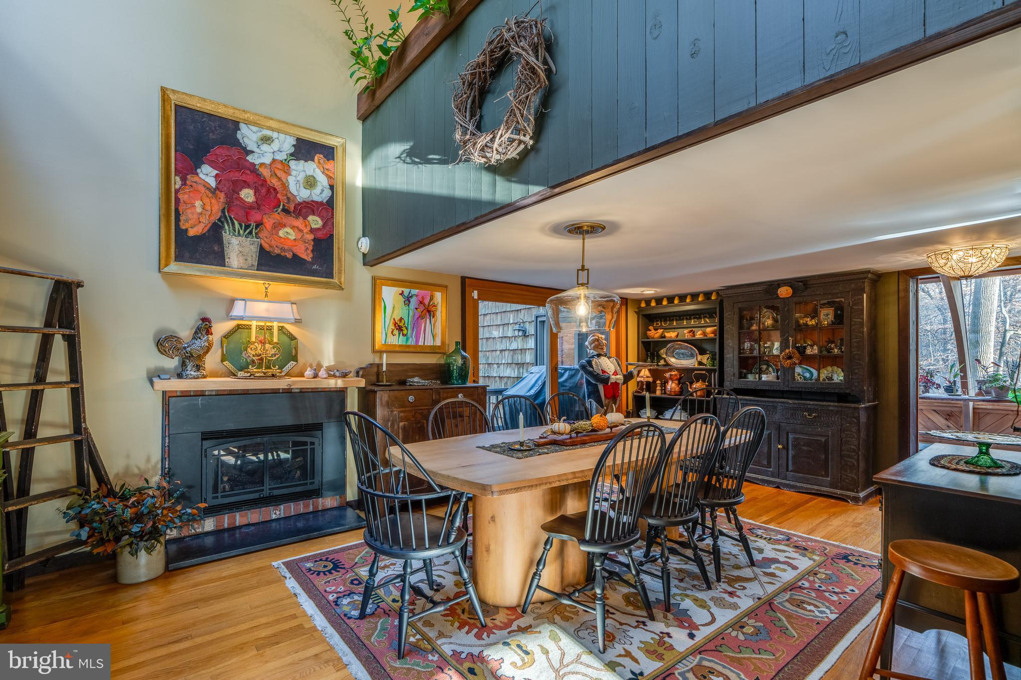 181 Old Mine Road Lebanon, PA 17042 - Photo 21 of 79 a view of a dining room with furniture a fireplace and wooden floor