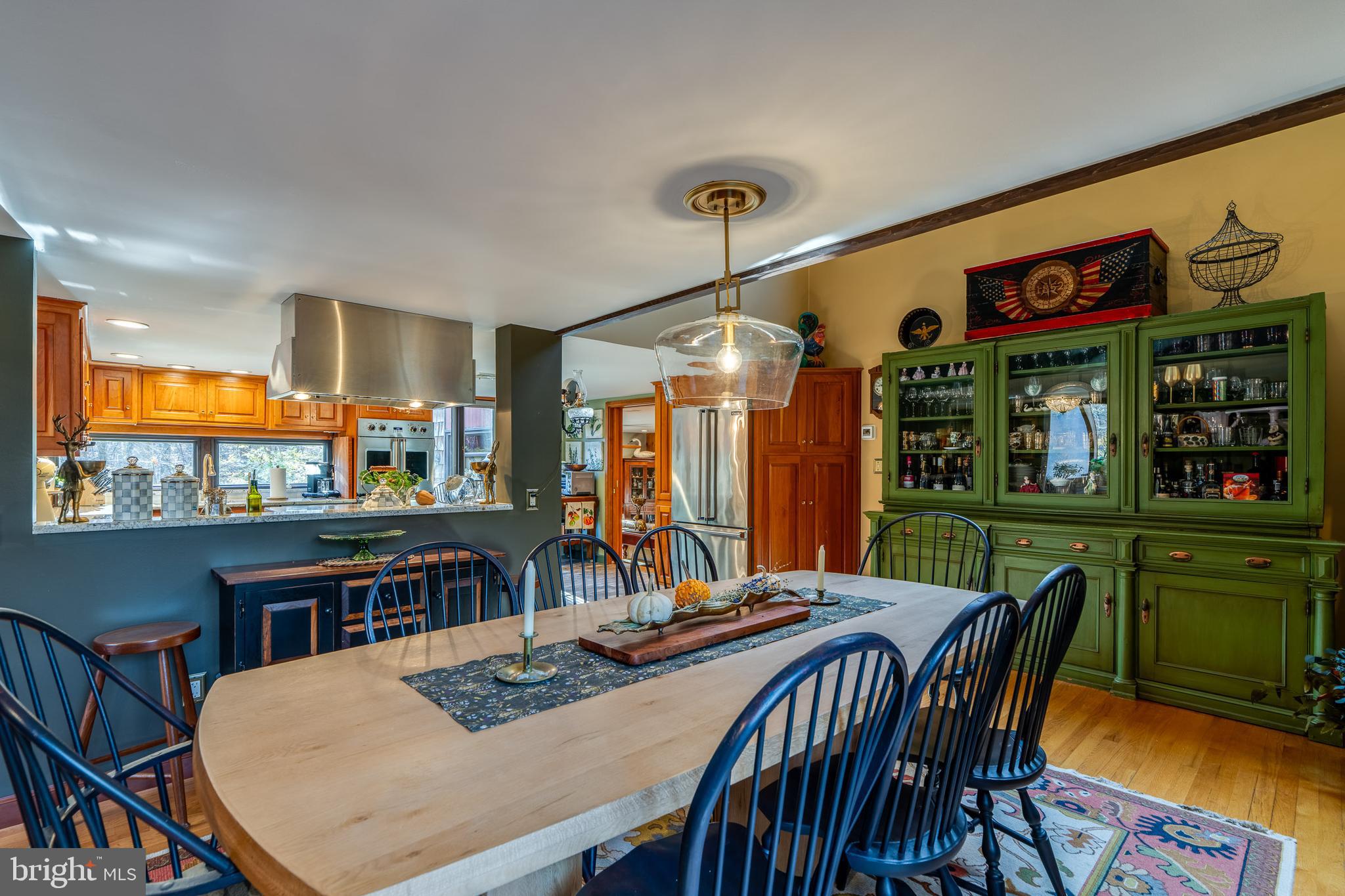 181 Old Mine Road Lebanon, PA 17042 - Photo 23 of 79 a view of a dining room and livingroom with furniture wooden floor a rug a painting and a chandelier